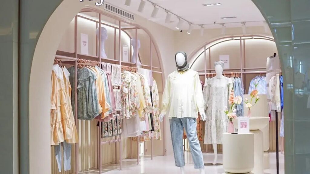 Pastel boutique clothing store interior with mannequins