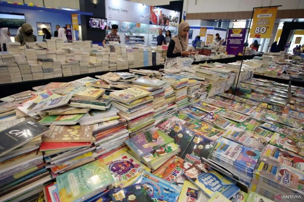 book sale tables piled with children's books