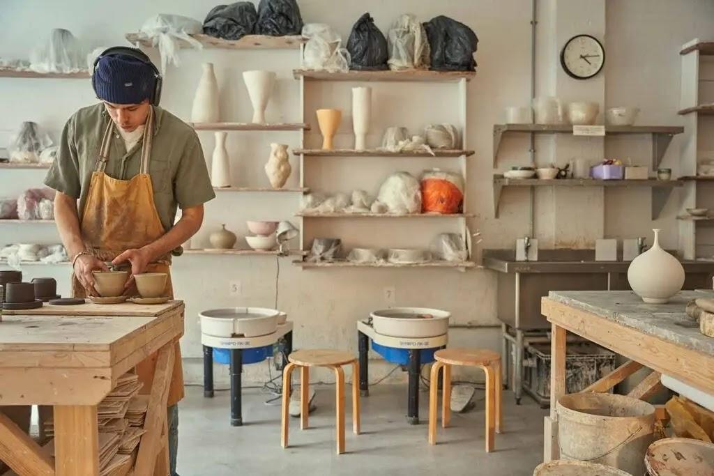 pottery studio with potter shaping clay