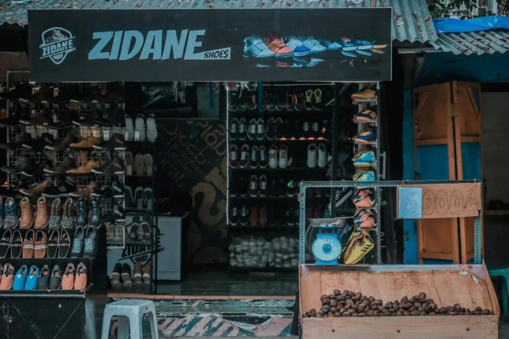 ZIDANE shoes logo on storefront with shoe display