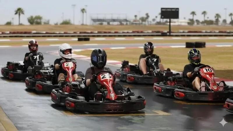 Go-kart race with drivers on a wet track