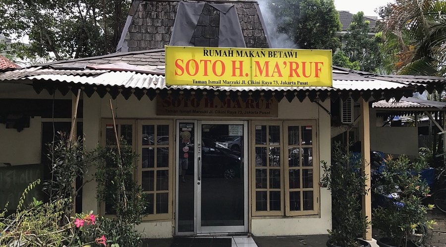 Rumah makan betawi Soto H. Ma’ruf storefront sign in Jakarta Pusat with entrance and surrounding plants