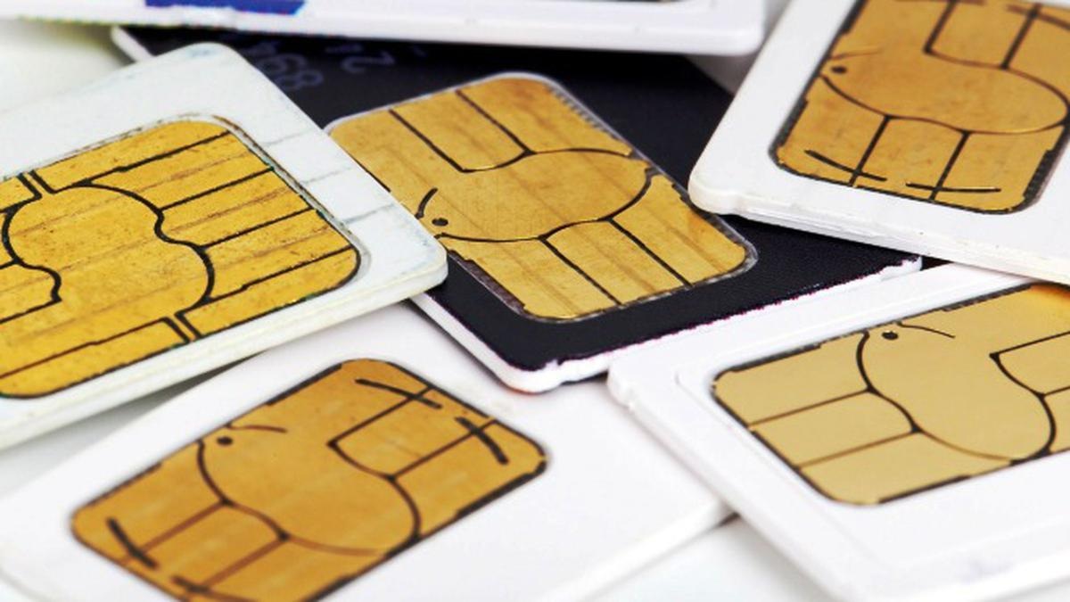 Assorted prepaid SIM cards with gold contacts and black circuitry on white holders