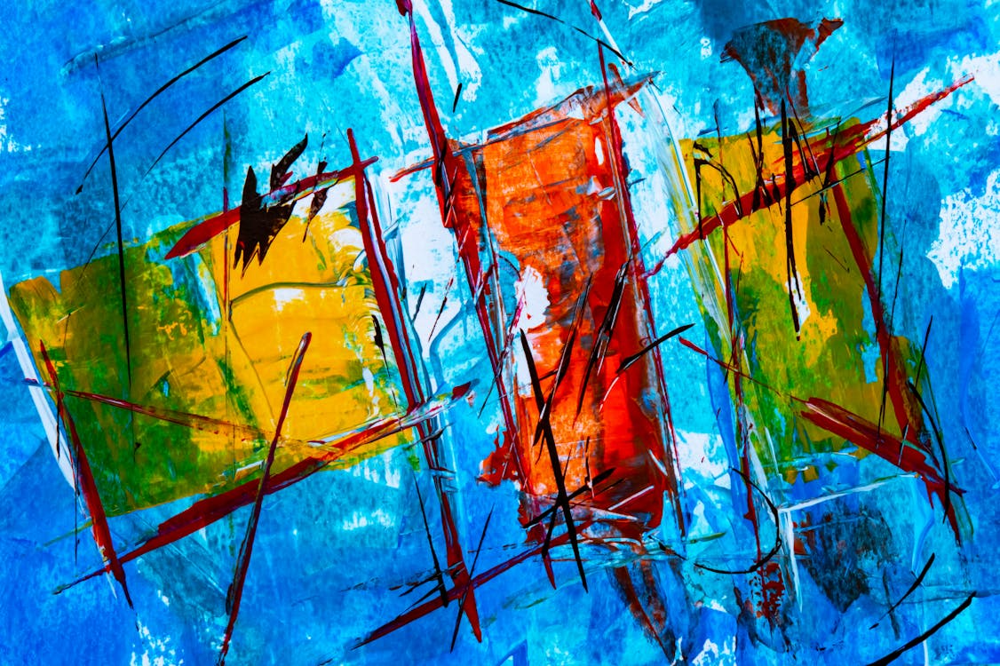 Colorful abstract graffiti wall with blue background, splashes, and black marker lines