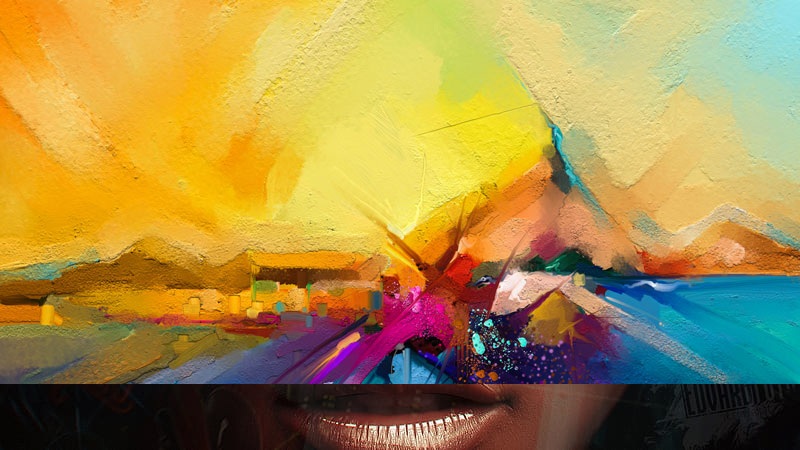 Abstract colorful street-art graffiti wall beside a close-up human face with bright paint splashes