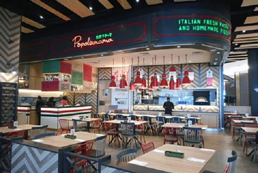 Italian fresh pasta and homemade pasta stall inside a food court with red chairs and tables