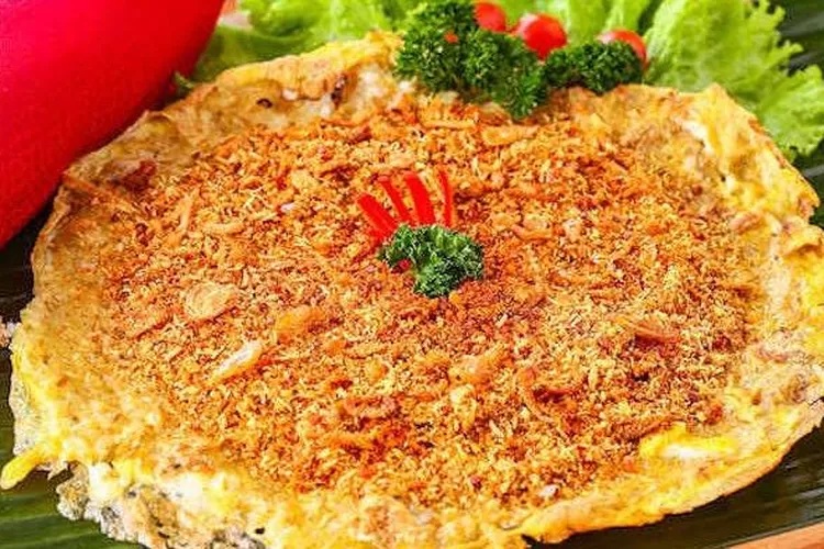 Spicy cheese pizza topped with red chili flakes and fresh broccoli on a black plate