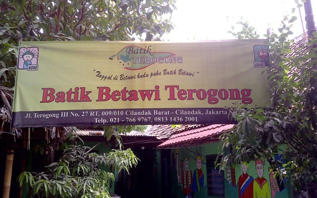 Batik Betawi Terogong storefront sign with “Batik Betawi Terogong” text and neighborhood entrance banner