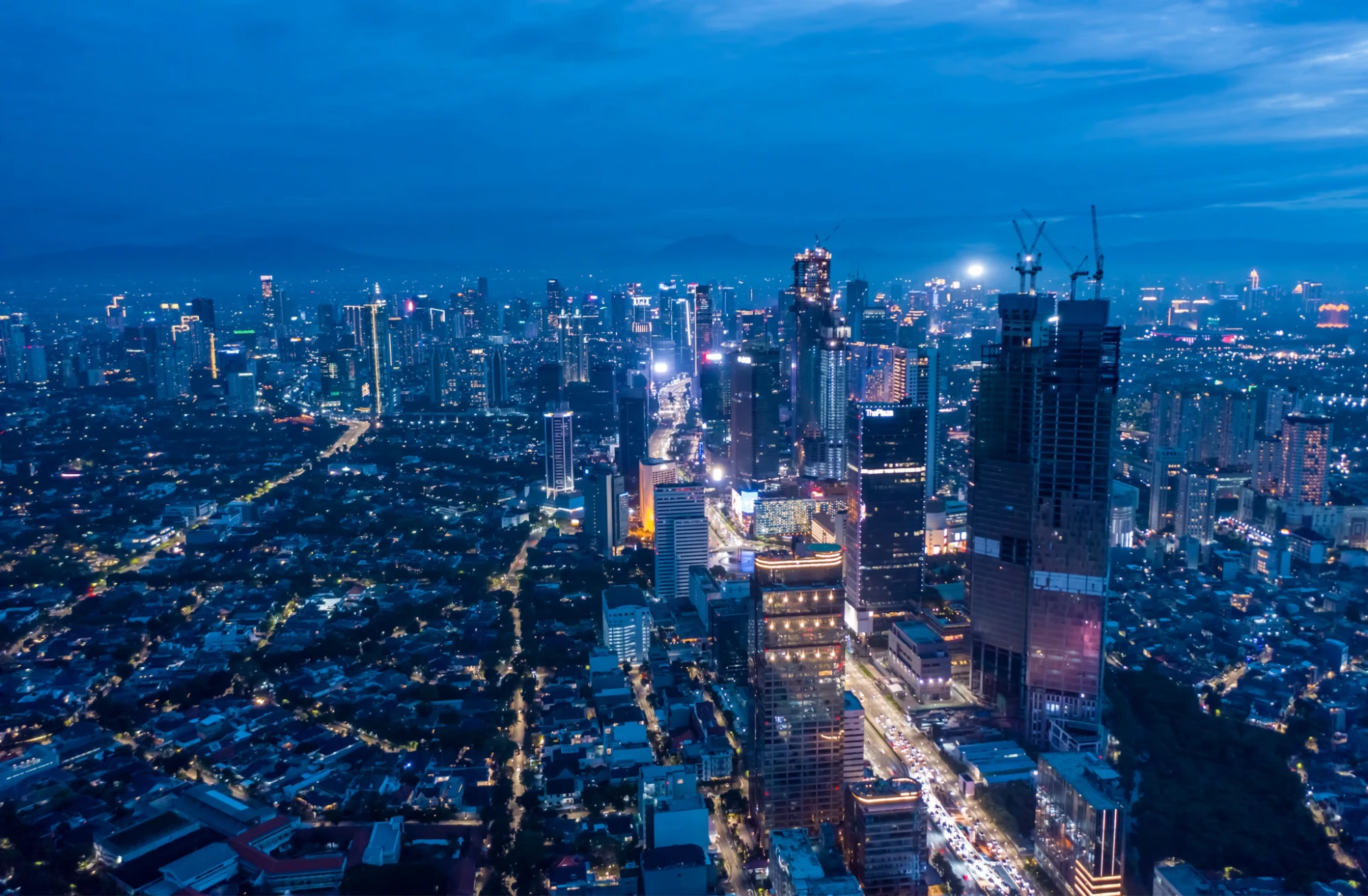 aerial night view of the illuminated jakarta city skyline
