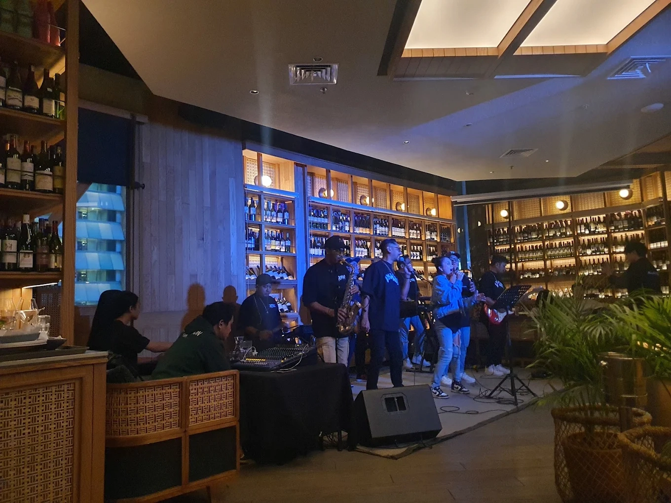 band performing live inside a cozy dimly lit venue