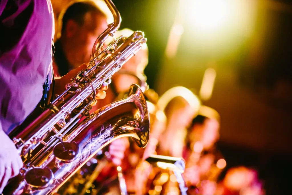 close up of saxophonist playing saxophone live on stage
