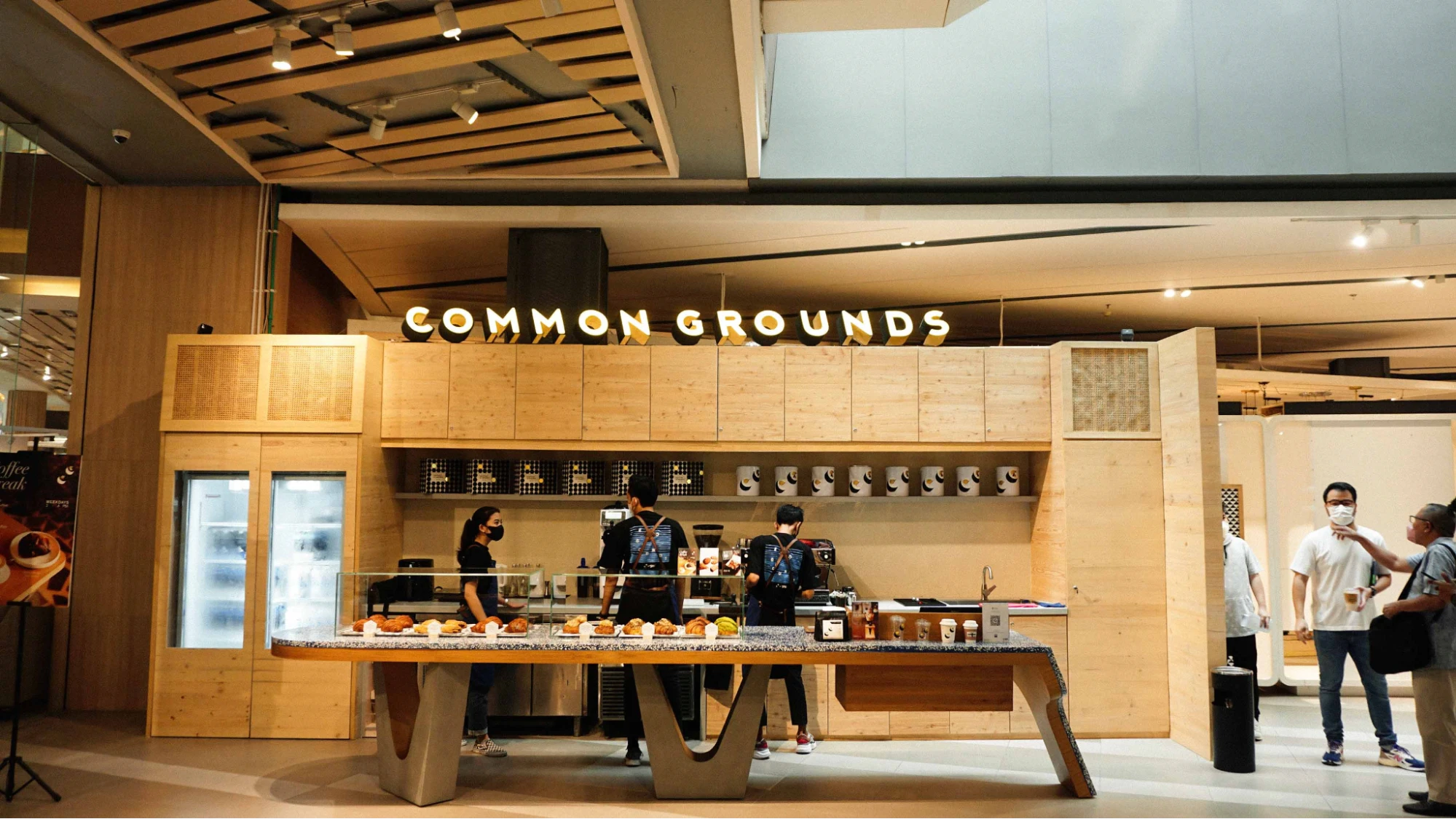 common grounds coffee shop counter inside a modern shopping mall