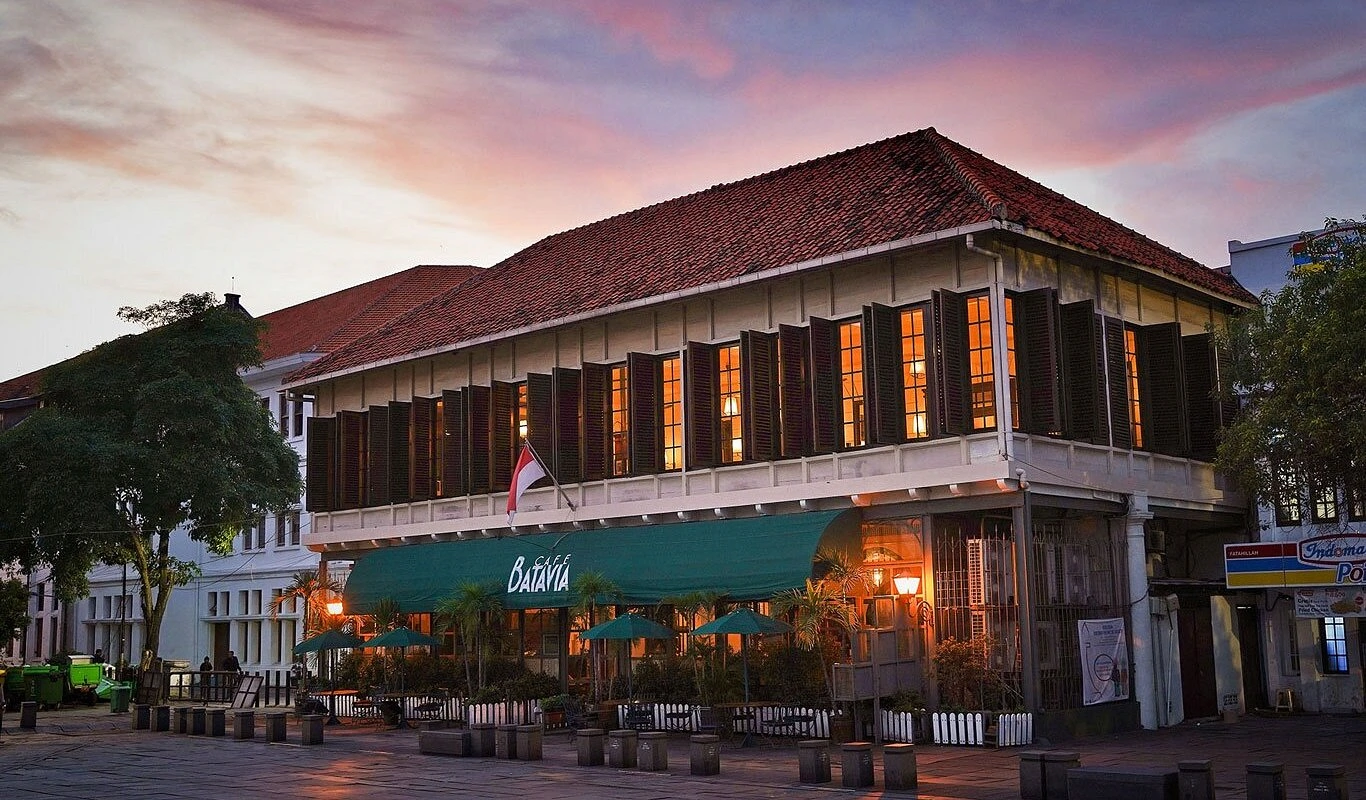 exterior view of cafe batavia building at dusk