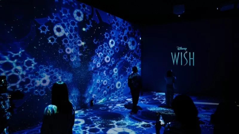 immersive digital light display showing blue patterns and disney wish logo