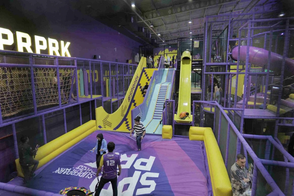 indoor activity center with slides trampolines and play structures