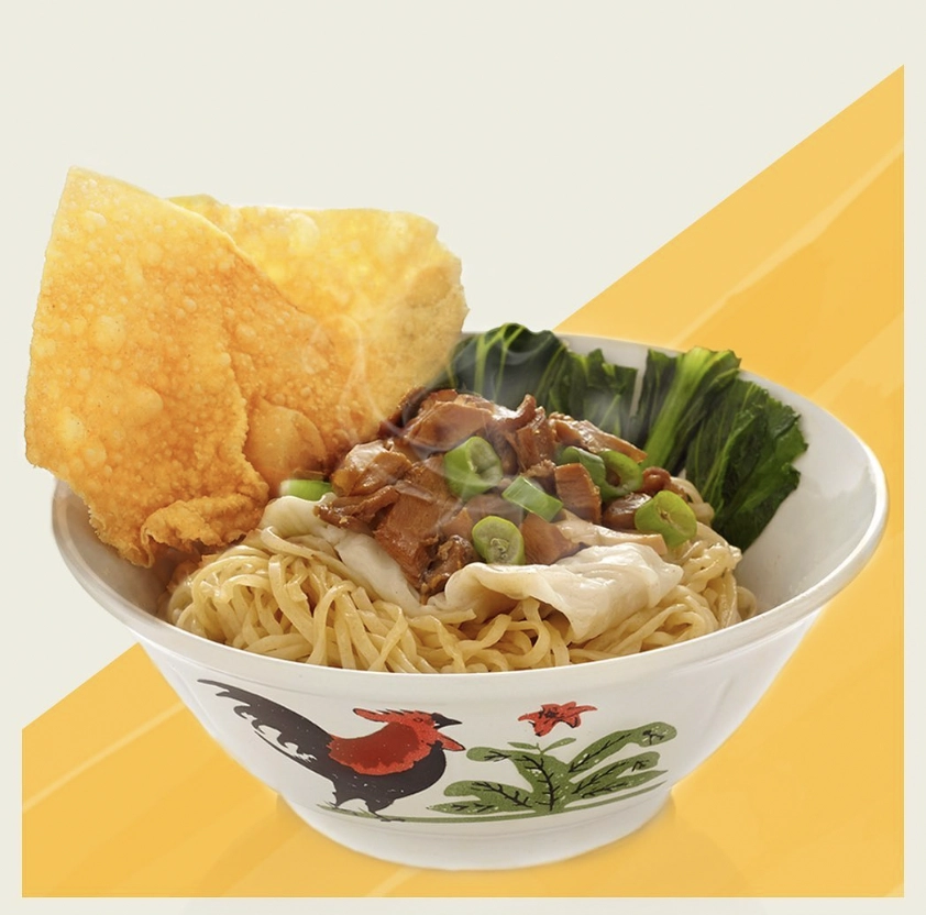 mie ayam served in traditional rooster bowl with crispy crackers
