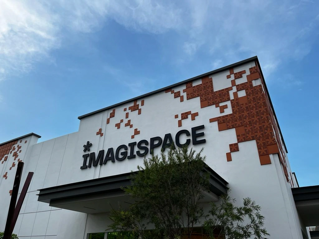 modern building exterior with imagispace sign and clear sky