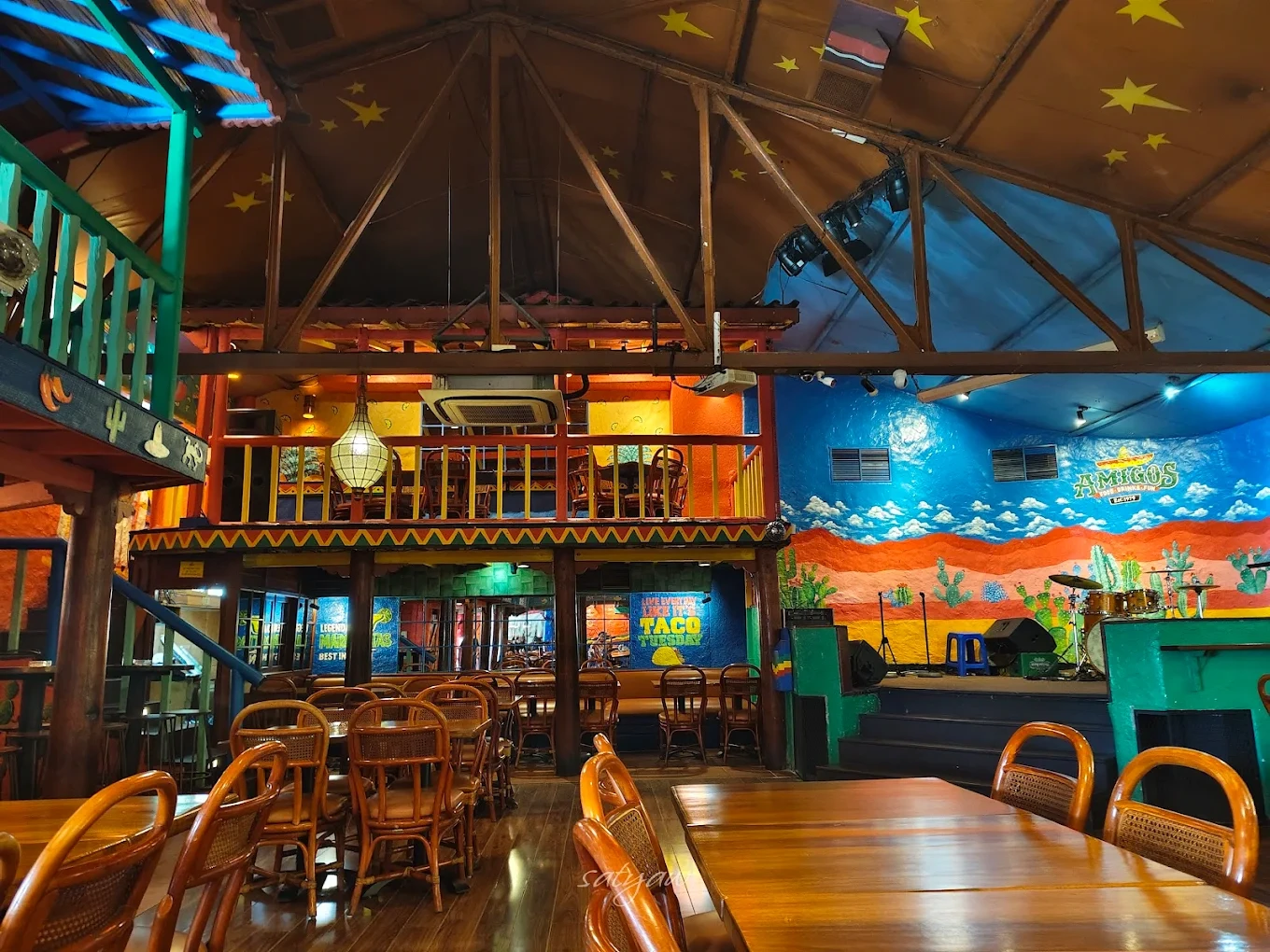 vibrant mexican restaurant with wooden seating